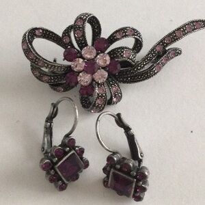 Antique silver brooch and dangling earring with purple stones